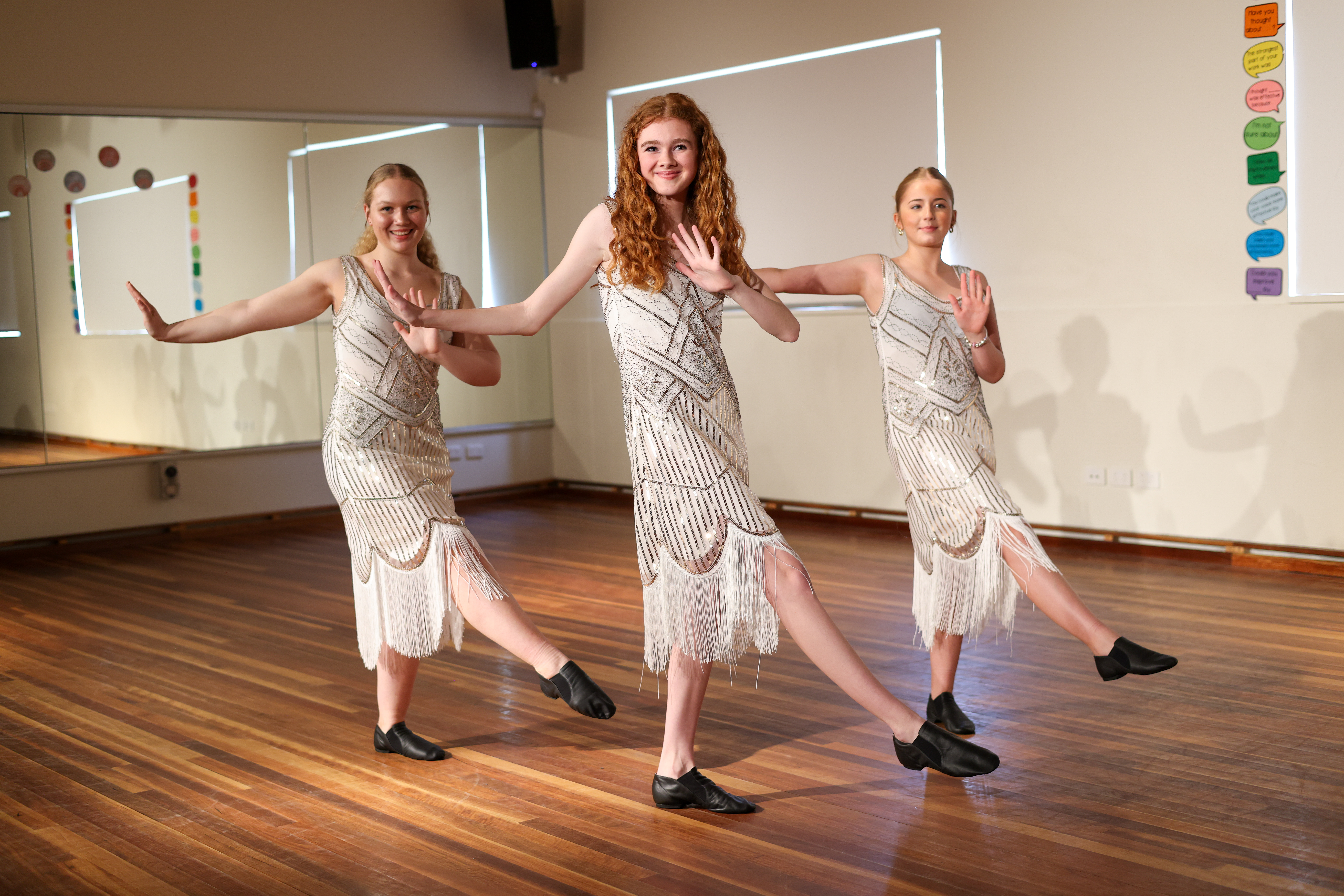 Students rehearsing a dance routine in 1920s costumes