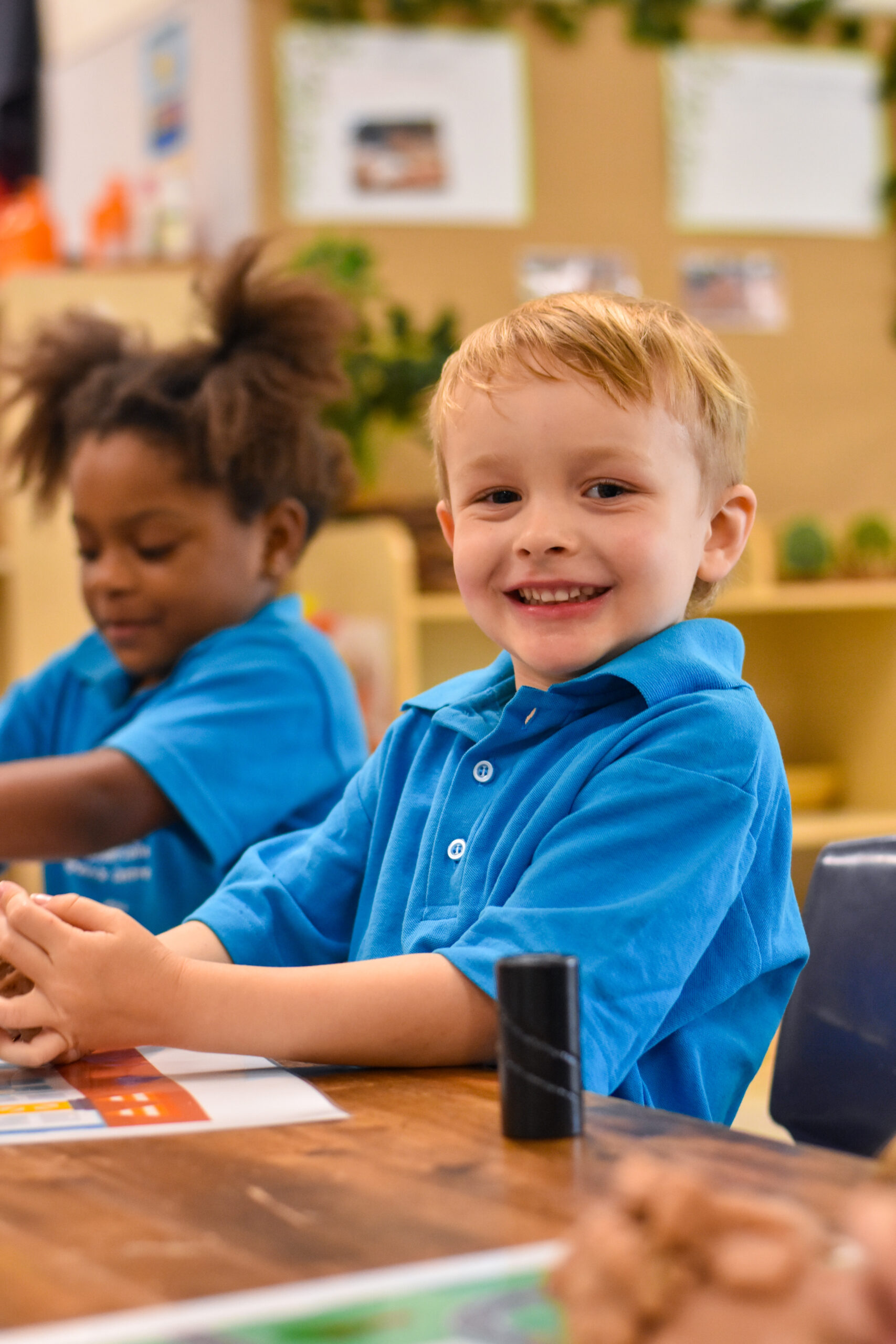 Young child smiling during an activity at the Children's Centre