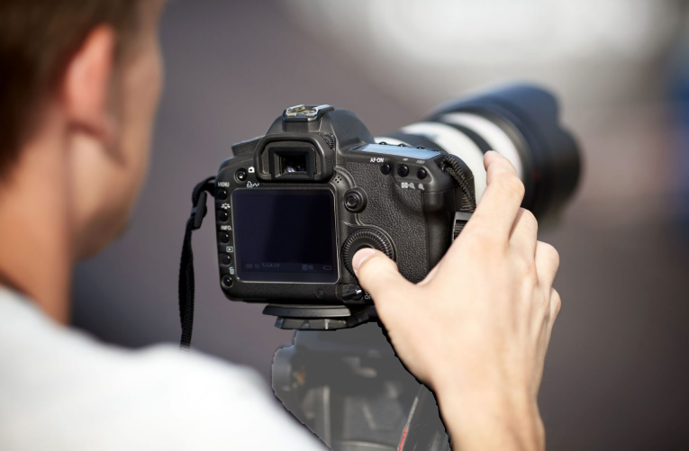 Photographer using a DSLR camera