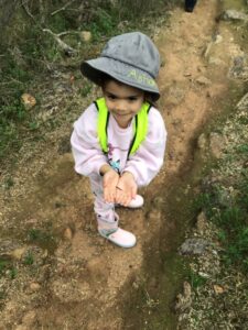 Bush Kindy child standing on a dirt bush track