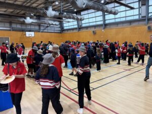 Students browsing stalls in the gym during Year 6 Enterprise Day