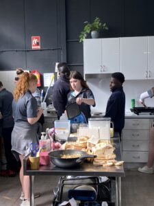Students preparing food together in the HOPE Street kitchen