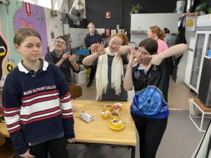Students decorating cupcakes together in the HOPE Street kitchen