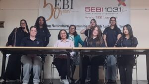 Year 9 Indonesian students in front of the 5EBI 103.1 FM 50 years banner