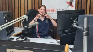 Year 9 student at the microphone in the 5EBI 103.1 FM studio