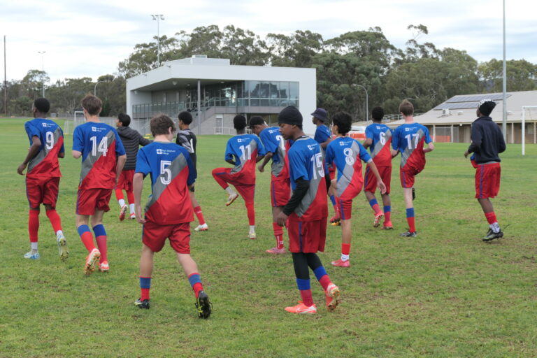 Year 9/10 boys knockout soccer team warming up before the match