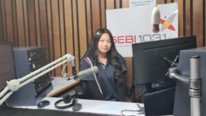 Year 9 student at the microphone in the radio studio